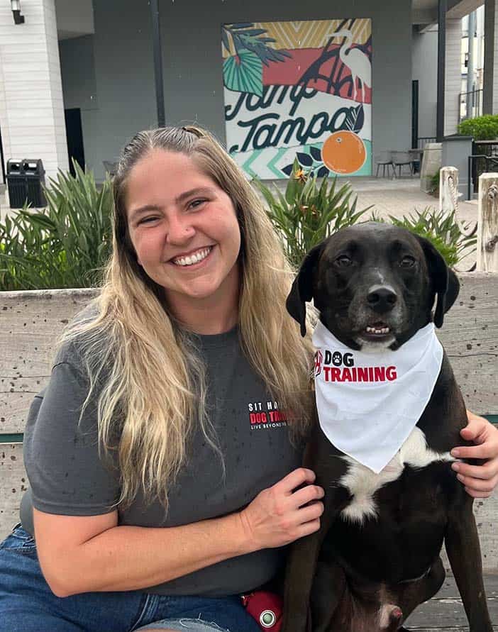 Jenna, expert dog trainer in Tampa, FL, with her dog.